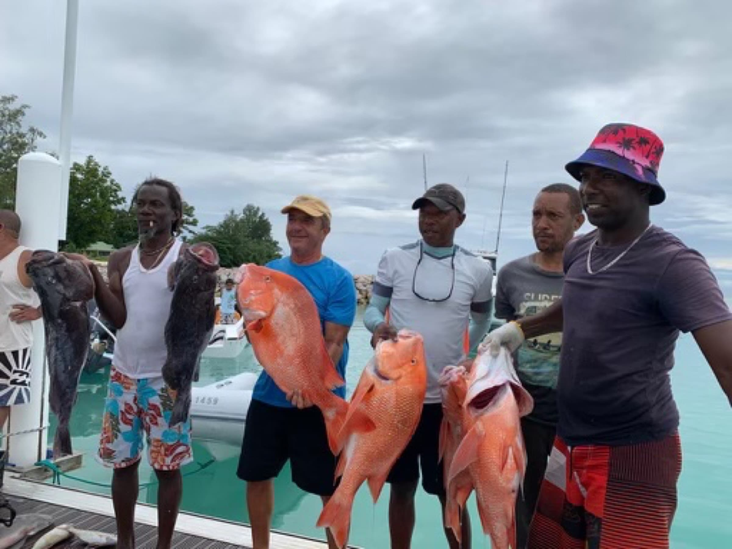Local Seychellois crew with the day’s catch after a deep-sea fishing trip